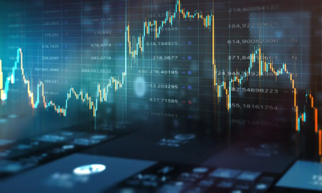 Candlestick chart showing fluctuating stock prices on a dark blue screen, with blue and orange bars and grid lines