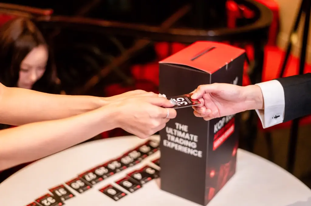 Guest receiving a lucky draw number at the KOP Run After Party