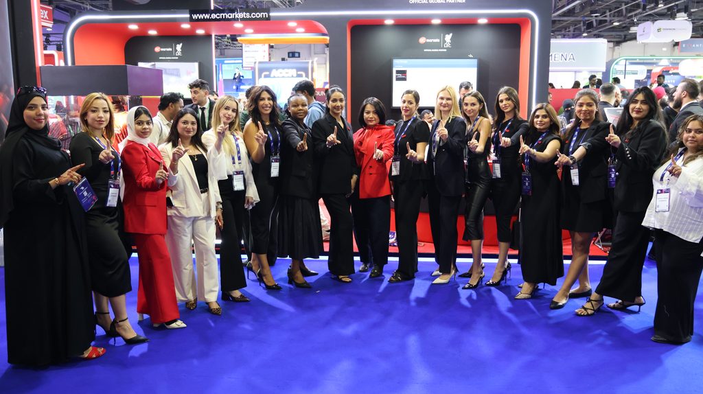 EC Markets team members at the Dubai exhibition booth