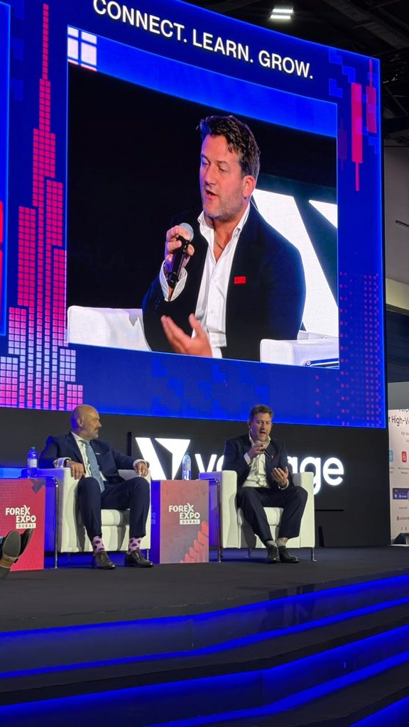 Matthew Smith speaks on stage at Forex Expo Dubai 2026