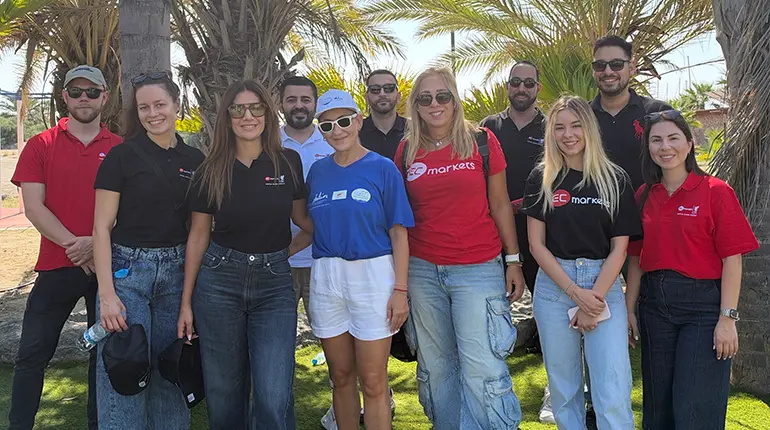 EC Markets team volunteering at the Limassol beach clean-up for World Maritime Day